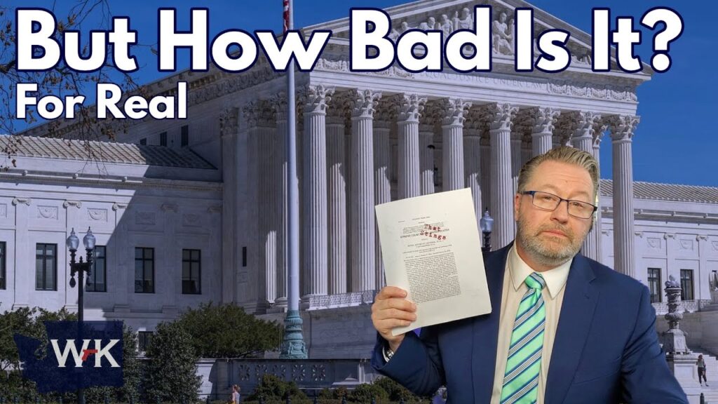 A man in a suit and striped tie holds a document in front of a large classical building with columns. Text on the image reads, "But How Bad Is It? For Real." The initials "WK" appear in the bottom left corner.