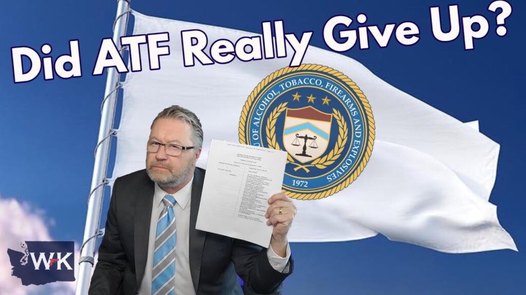 A man in a suit holds up a document, sitting in front of a large white flag and the ATF seal. The text above him reads, "Did ATF Really Give Up?" and there's a WK logo in the bottom left corner.