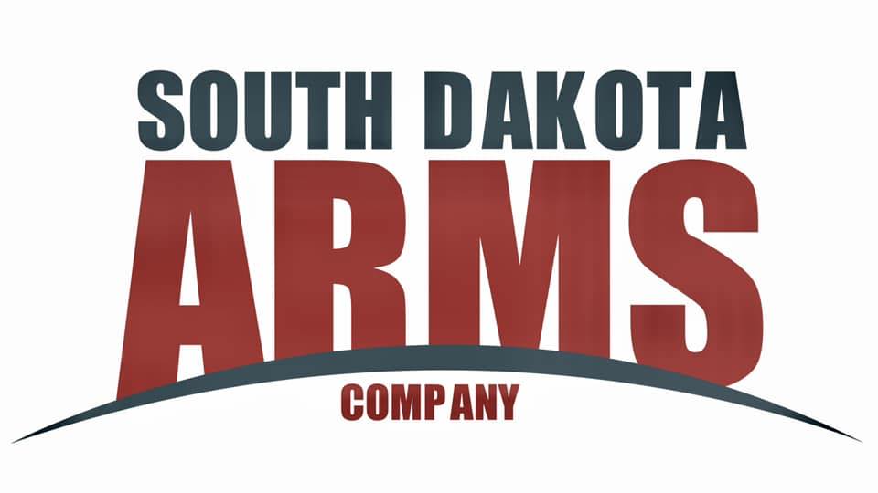 Logo with the words "South Dakota Arms Company." "South Dakota" is in dark green, "ARMS" is large and red, and "Company" is smaller in red below, all set above a curved line.