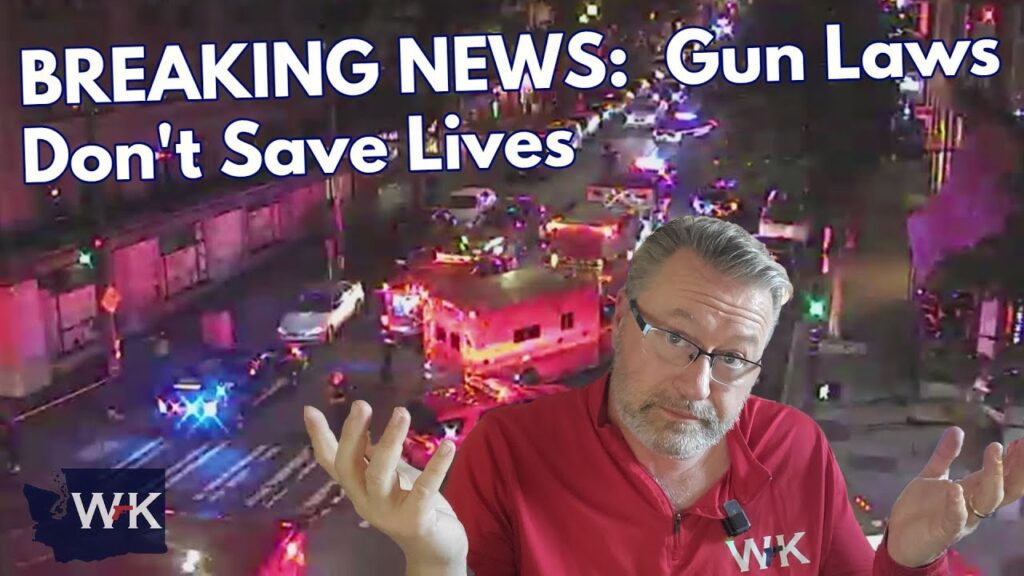 A man in a red shirt shrugs in front of a busy nighttime street scene with emergency vehicles. Large text reads, "BREAKING NEWS: Gun Laws Don't Save Lives." The WK logo appears in two places.